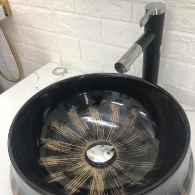 Chậu tròn đen ánh vàng